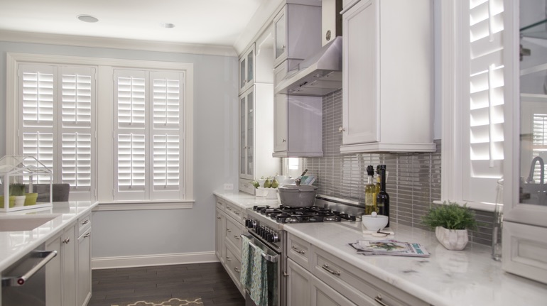 White shutters in San Antonio kitchen with white cabinets.